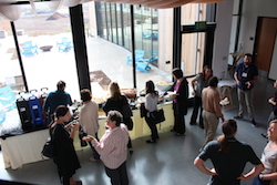 overhead view of guests mingling with breakfast buffet in background